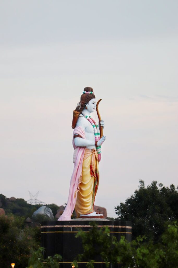 Magnificent statue of Lord Rama standing tall against the scenic backdrop, symbolizing Indian culture and spirituality.